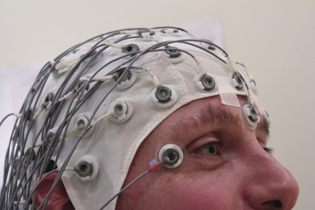 A cap holds electrodes in place while recording an EEG.